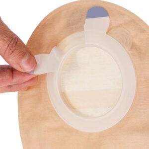 Aura 2 piece stoma pouch with a hand releasing the protective liner