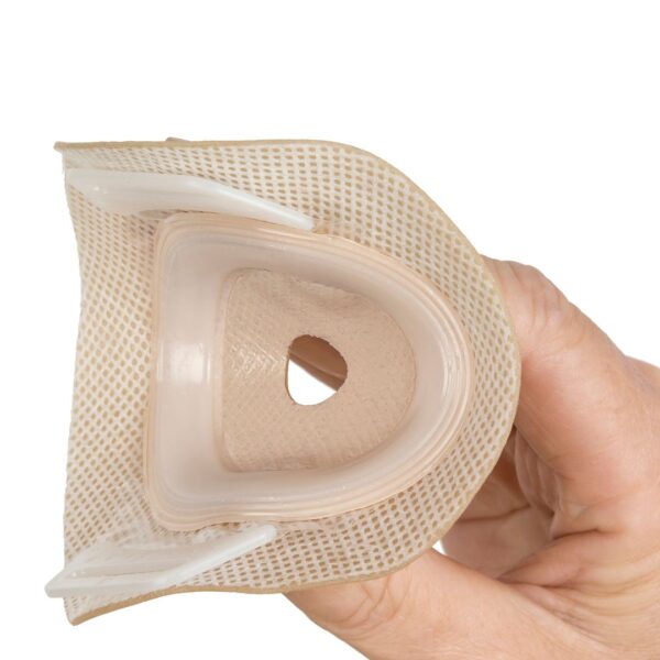 Aura convex with a hand pressing on the flange showing the flexibility