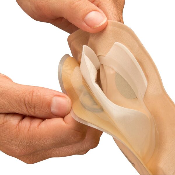 Aura Flushable with a hand showing the layers of the inside pouch
