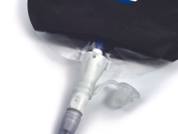 A black Aura Plus urostomy bag attached to a drainage tube