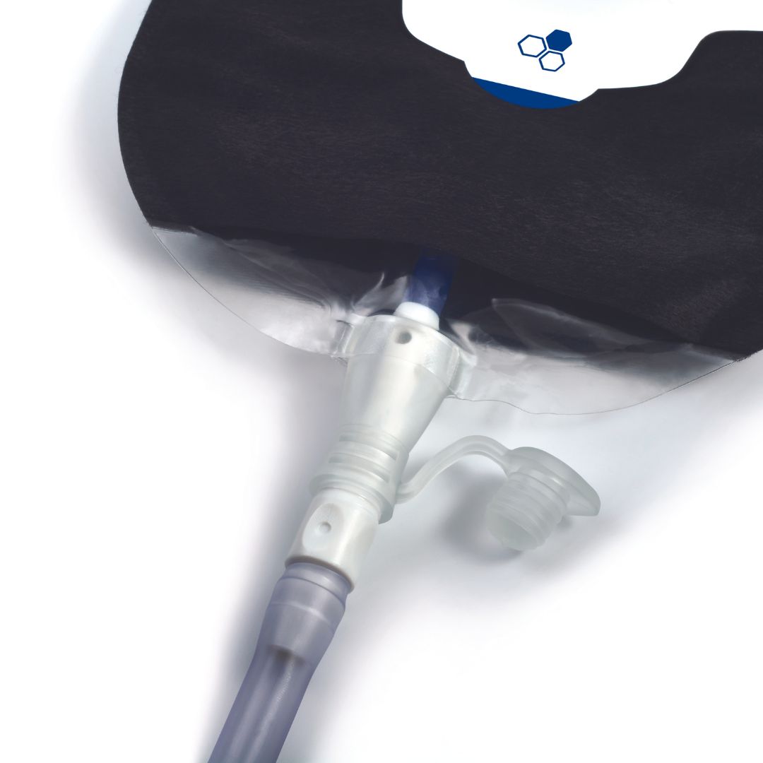 A black Aura Plus urostomy bag attached to a drainage tube