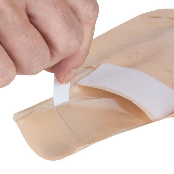 Aura Profile drainable with a hand removing the release liner of the drainage
