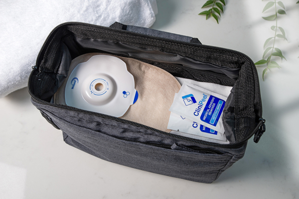 Aura Plus soft convex closed sand in a bag with two CliniPeel Medical Adhesive Remover wipes.
