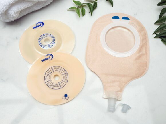 Aura two piece urostomy bag with other cover and two flanges flat and convex.