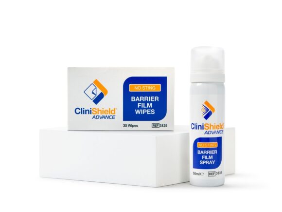 A box of CliniShield Advance wipe sachets on a white box and a can of CliniShield Advance barrier film spray next to it.