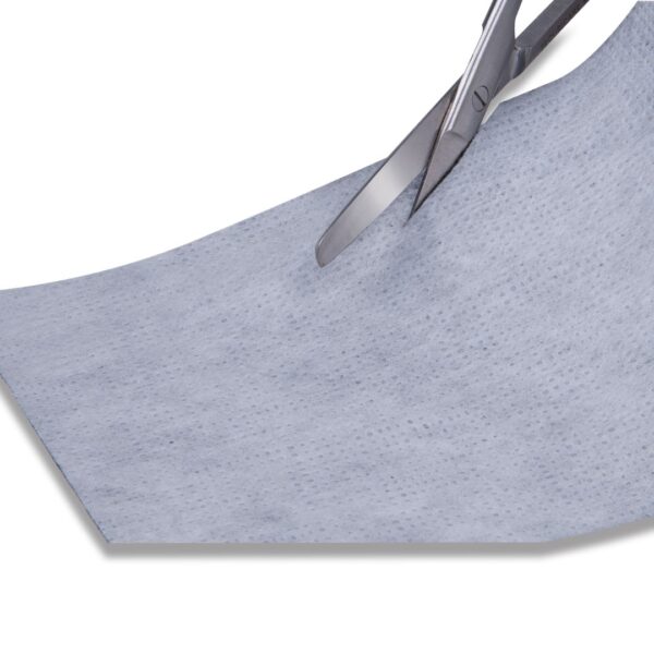 A pair of scissors cutting through a CliniSorb dressing