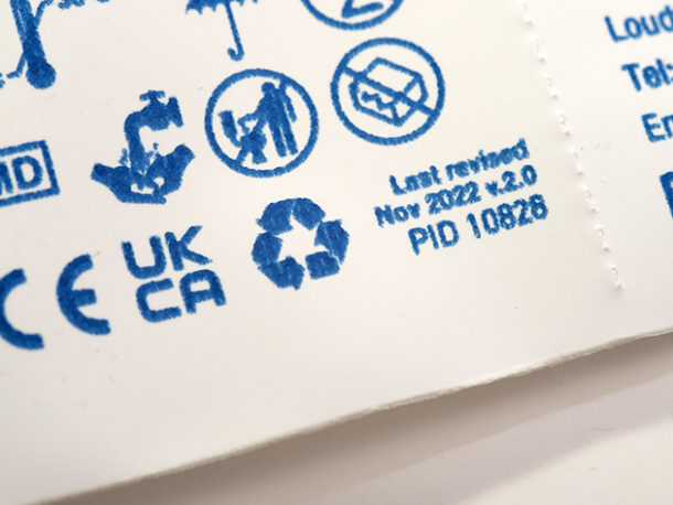 A close-up of the recycling information on CliniSure sheath packaging.