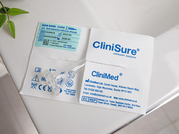 A CliniSure sheath sticking out of its packaging on the corner of a sink.