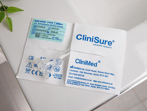 A CliniSure sheath sticking out of its packaging on the corner of a sink.
