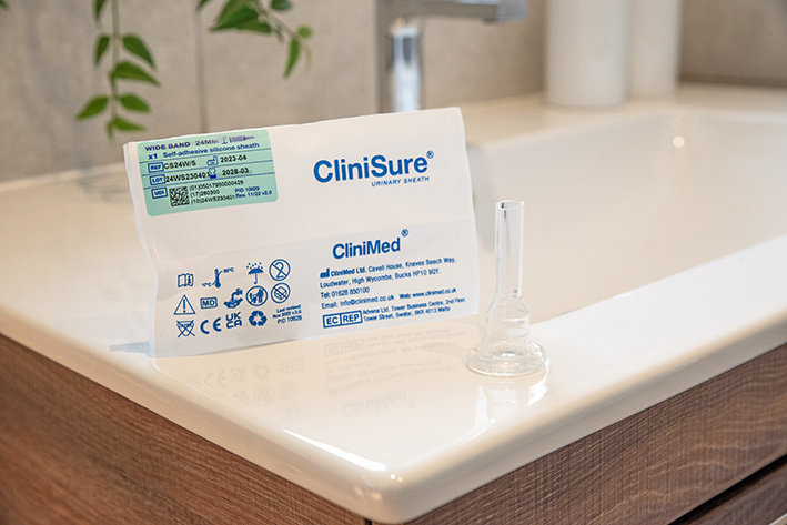 A CliniSure sheath next to its packaging on the corner of a sink.