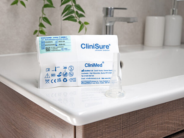 A CliniSure sheath next to its packaging on the corner of a sink.