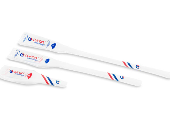 Three Curan Advantage catheters in their packaging, each is a different length.