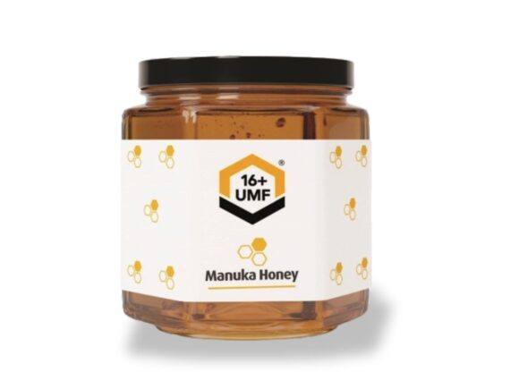 A jar of Manuka honey with a black lid and a white label