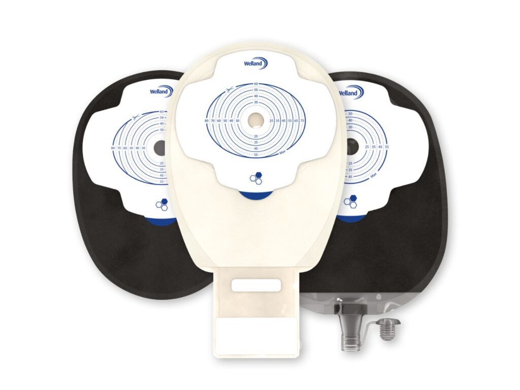 Three Aura Plus stoma bags, a black closed bag, a sand drainable bag and a black urostomy bag.