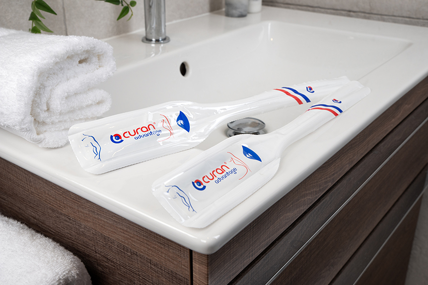 Two Curan Advantage catheters in its packaging on the side of a sink