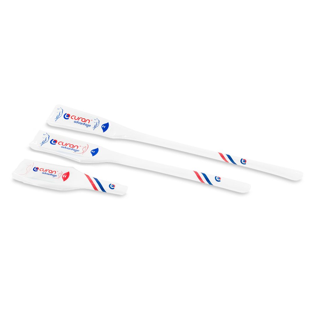 Three Curan Advantage catheters in their packaging, each is a different length.