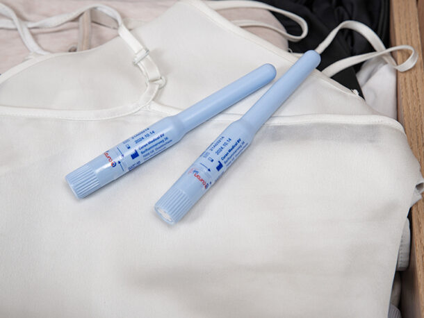 Two Curan lady catheters on a white top in a drawer.