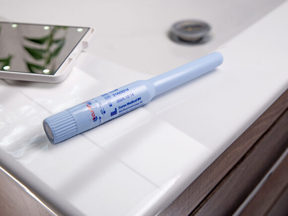 Curan lady catheter on a sink with a mirror.