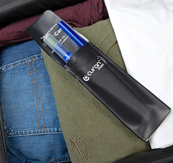 Curan man in a Curan wallet in a suitcase full of clothes.