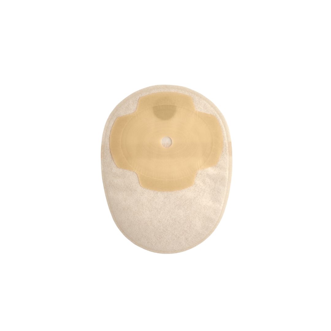 A sand Aura Plus closed stoma bag with the paper removed from the adhesive flange