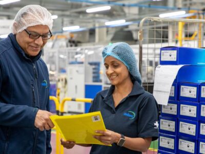 Welland employees checking stoma pouch delivery