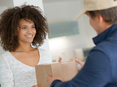 lady receiving a parcel at her front door