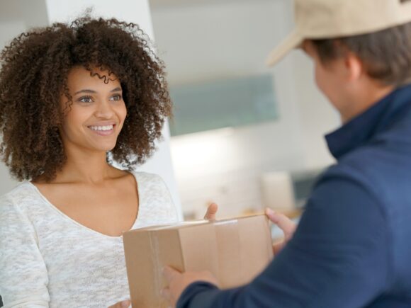 lady receiving a parcel at her front door