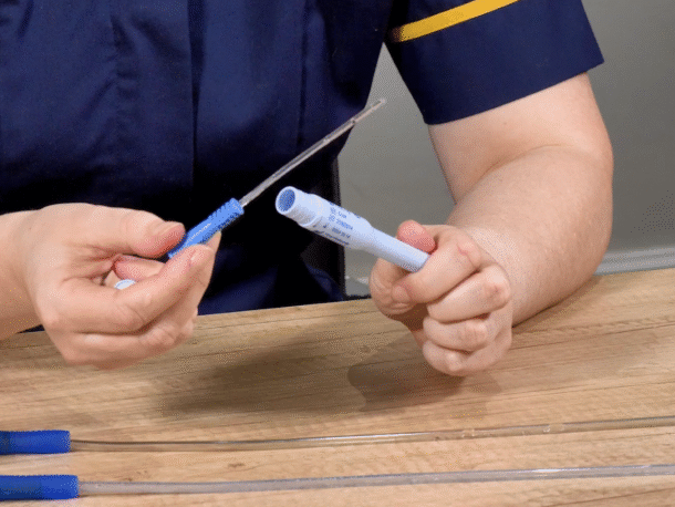 Louise Harrison showing a gel catheter