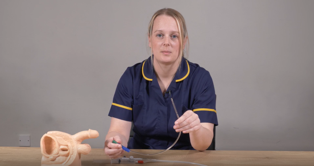 Louise Harrison showing the intermittent self-catheter