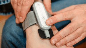 Photo of a person wearing Tensi+ on their ankle.