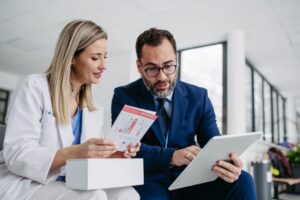 Product specialist talking to a clinician on a ward