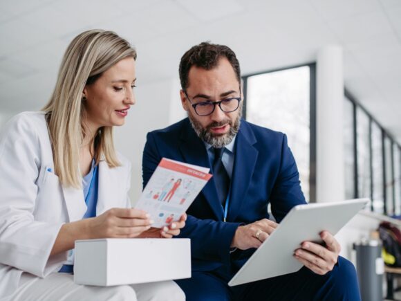 Product specialist talking to a clinician on a ward