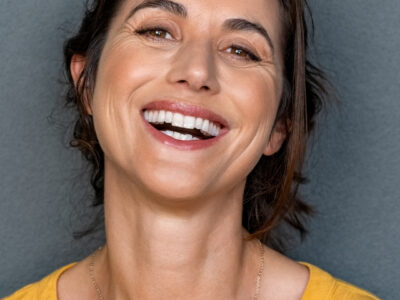 Photo of a woman smiling at the camera.