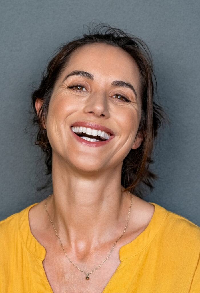 Photo of a woman smiling at the camera.