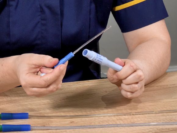 Louise Harrison showing a gel catheter