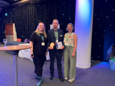 Photo of Chris Woodward at ACP conference collecting the Industry Innovation Award 2026 for Tensi+