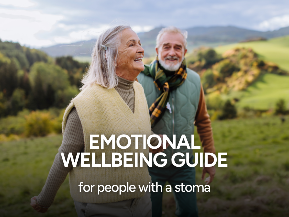 Image of a man and woman walking through a field together alongside text 'Emotional wellbeing guide for people with a stoma'