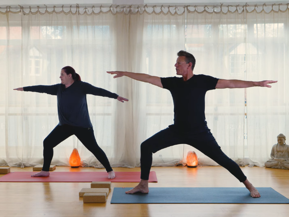 Image of Steve and Michelle doing a yoga pose
