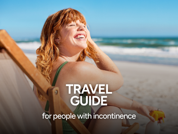 Photo of a woman sat on a sun lounger at the beach smiling with text 'Travel guide for people with incontinence'