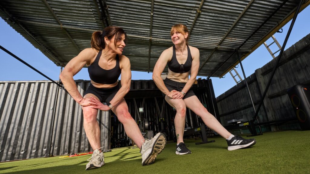 Photo of Shelley and Nina performing stretches