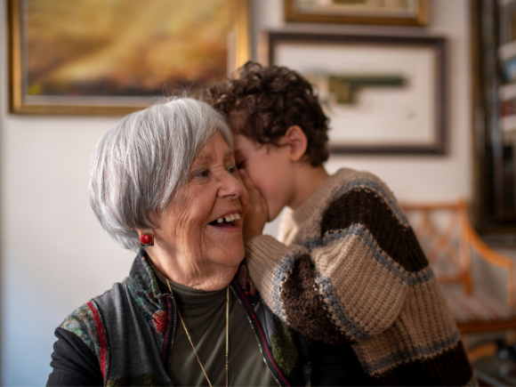 Image of a grandma and grandson at home