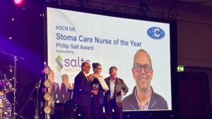 Photo of Kevin Hayles receiving the Stoma Care Nurse of the year award at ASCN 2026 (Association of Stoma Care Nurses)